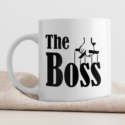 The Boss feliratú fehér kerámia bögre fekete marionett irányító kéz grafikájával